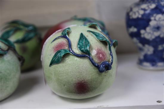 A pair of Chinese enamelled porcelain models of peaches, 19th century, length 16.5cm